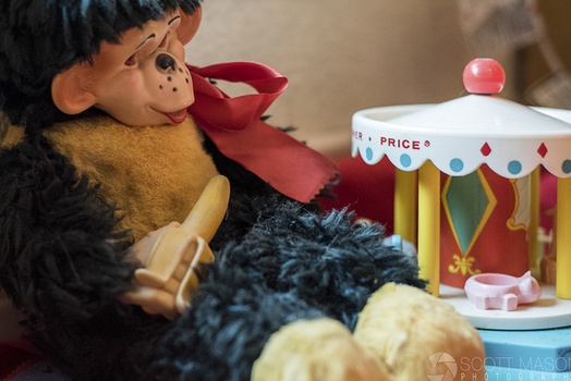 a plush monkey holding a banana