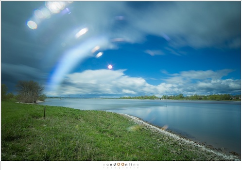 The reflection that occured when using a filter. This one is extreme, showing the blurred letters that are printed on the lens barrel.