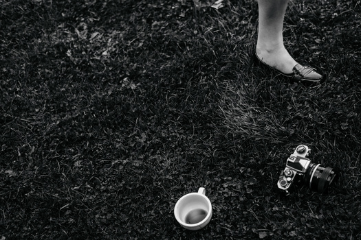 How to break out of editing block Monochrome shot of a girl's shoe, tea cup and a camera