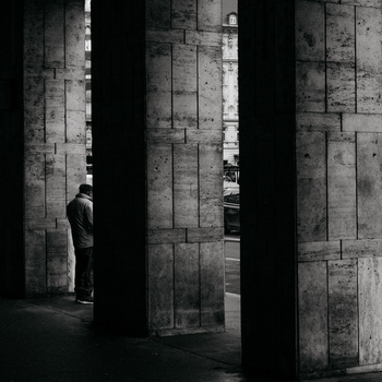 Learning why you should crop in photography A man on streets of Budapest.