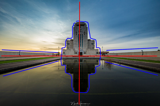 A central composition, where the subject is placed where the axis cross, and lines in the image lead the eye towards the subject.
