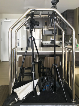 photography gear on a bellhop cart in a hotel