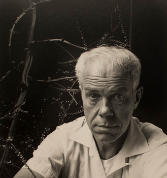 a portrait in front of trees by Imogen Cunningham in sepia