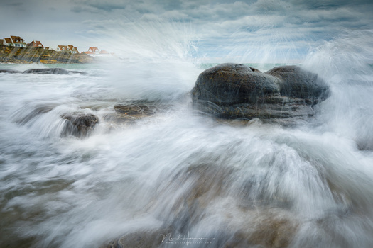 If you want to capture the dynamics of waves, you want to use relatively short shutter speeds. A dark neutral density filter won't work for these kind of images.