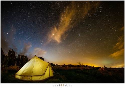 Camping under the stars, while the Perseids roam the night sky. Find a nice location for photographing shootings stars. It will enhance your photo a lot.