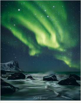 Reality or manipulation? It could be real, but it isn't. I merged a daylight photo of this beach at Lofoten, and added an aurora image I took that same photo trip.