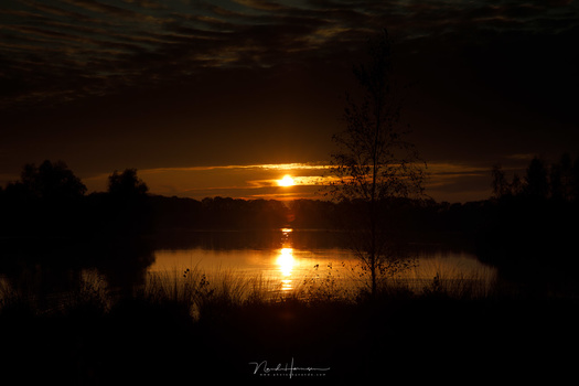 This photo of a sunset is not a low key, even if it has many dark tones. It is just underexposed. Nothing more.