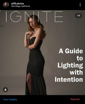 Woman in black dress posed against neutral backdrop with dramatic side lighting.