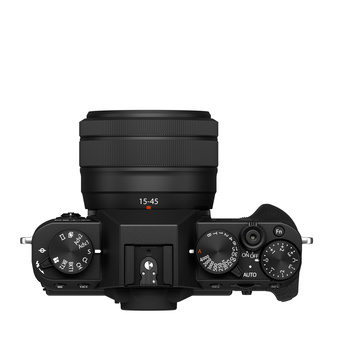 Top-down view of a mirrorless camera with 15-45mm lens and control dials visible.