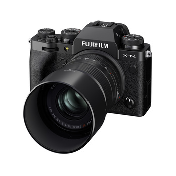 Fujifilm X-T4 mirrorless camera with attached telephoto lens and lens hood.