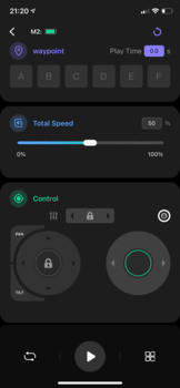 Screenshot of audio control interface with dual circular faders and playback controls on dark background.