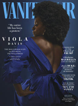 Vanity Fair magazine cover featuring a person in profile wearing a deep blue garment against a blue background.