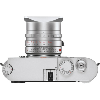 Top-down view of a silver rangefinder camera with attached lens and mechanical controls.