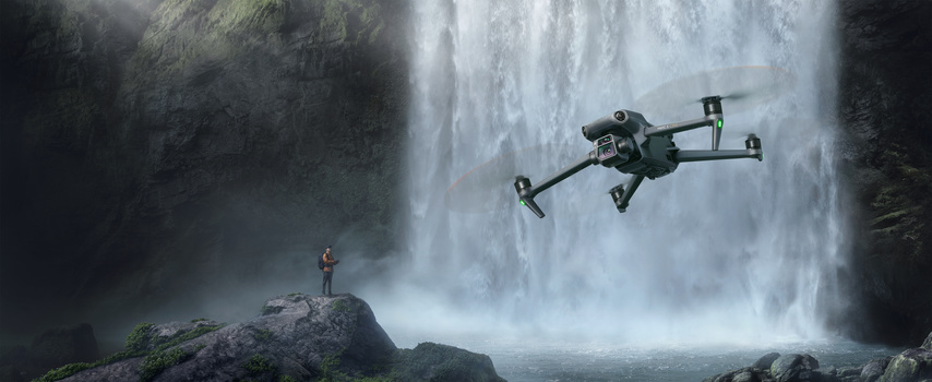 Illustration of a drone hovering above a person standing on a rock near a massive waterfall.