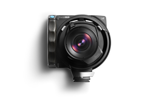 Black modular camera system with wide-angle lens and side-mounted handle against white background.