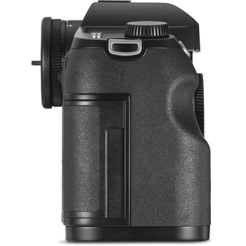 Black mirrorless camera body shown from the right side angle, displaying grip, electronic viewfinder, and articulating screen.