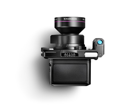 Top-down view of a medium format camera with bellows, dark finish, and blue release button on right side.