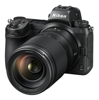 Nikon Z mirrorless camera with attached wide-angle zoom lens, positioned at three-quarter angle against white background.