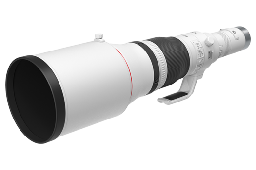 White telephoto lens with black barrel and focus ring against neutral background.