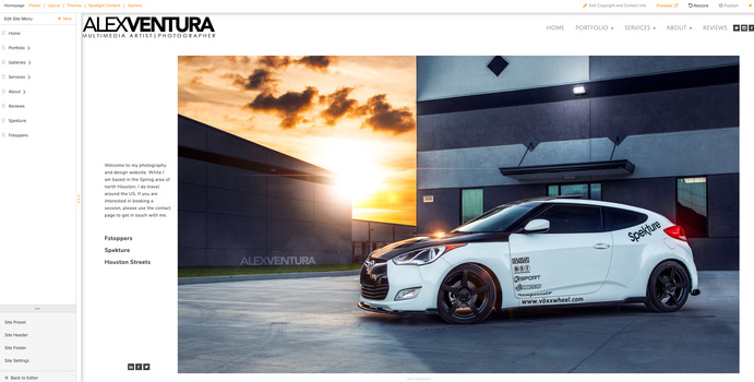 White tuned hatchback car parked in front of modern building at sunset.