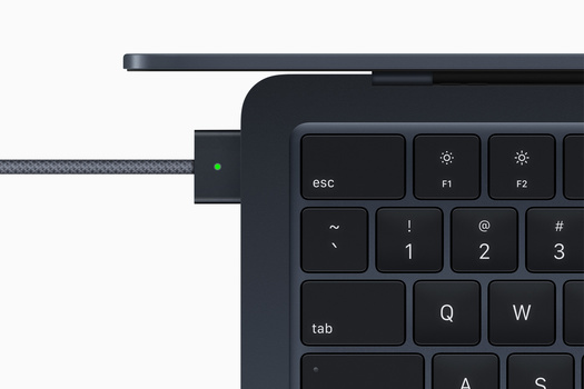 Screenshot of a laptop keyboard with a USB-C cable connected to the port on the left side.