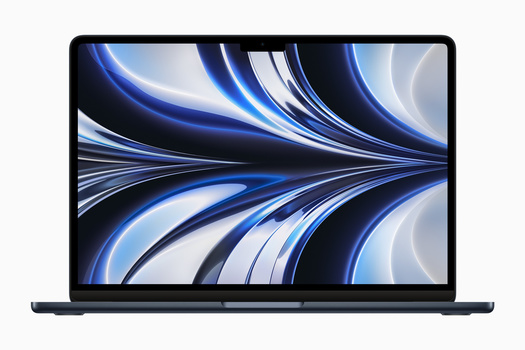 Screenshot of a laptop displaying abstract blue and white flowing curved lines in a digital wallpaper or screensaver.