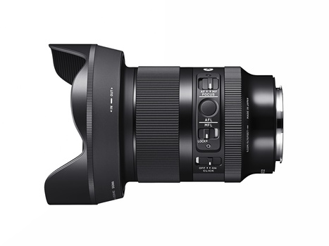 Wide-angle prime lens with hood attached, shown in profile against white background.