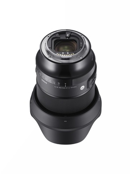 Black telephoto lens with focus ring and depth-of-field scale, shown in overhead view with glass elements visible at top.