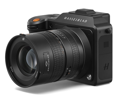 Hasselblad medium format camera with attached telephoto lens on white background.