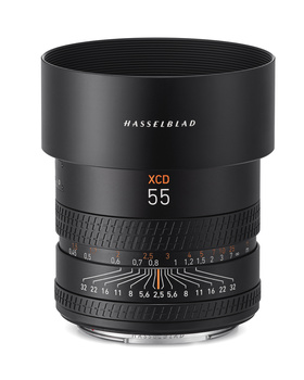 Hasselblad XCD 55mm lens mounted on white background showing focus and aperture rings.