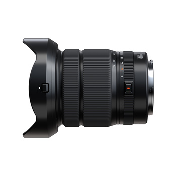 Wide-angle zoom lens with attached lens hood shown against white background.