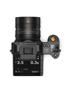 Top-down view of a mirrorless camera body with mounted 38mm lens and articulating screen.