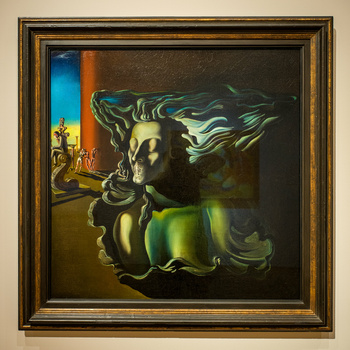 Surrealist painting of a sculptural bust with flowing, translucent green fabric billowing from its head against a dark background.