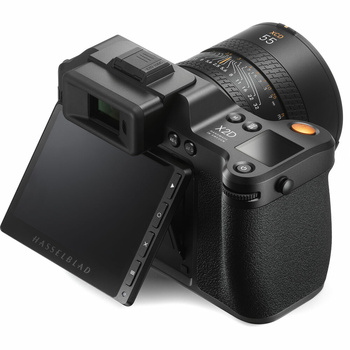 Mirrorless camera with articulating LCD screen and attached telephoto lens, shown from three-quarter view with screen extended.