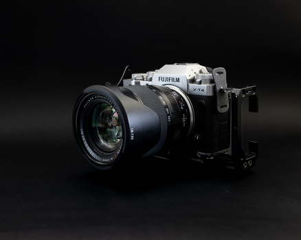 Fujifilm GFX medium format camera with attached lens on dark background.
