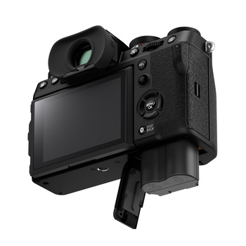 Mirrorless camera shown from rear three-quarter angle, displaying LCD screen and control buttons.