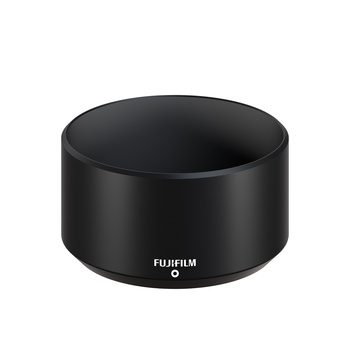 Black cylindrical camera lens hood with Fujifilm branding on front. Product shot.