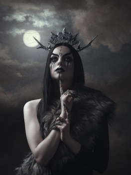 Dark-haired figure with spiked crown gazes upward beneath full moon against stormy sky.