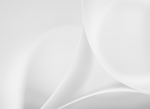 Soft, flowing abstract forms rendered in white and gray tones with smooth gradients.