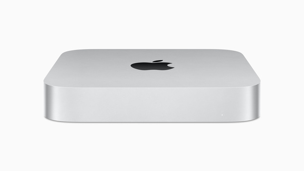 Silver aluminum desktop computer with rounded corners and black Apple logo on top.