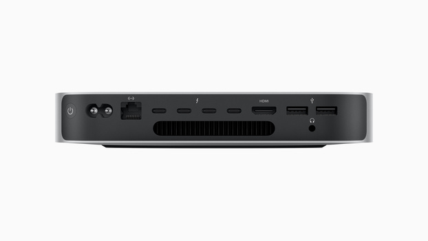 Front view of a compact desktop computer with multiple ports and ventilation grille.