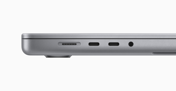 Close-up of a laptop's top edge showing ports and connectivity options in space gray.