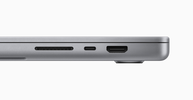 Side view of laptop ports including SD card slot, USB-C port, and HDMI connector on gray aluminum chassis.