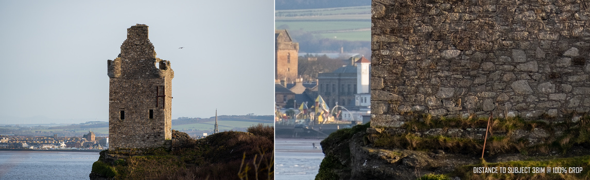 Ancient stone tower ruins on a rocky outcrop overlooking a coastal town and waterway.