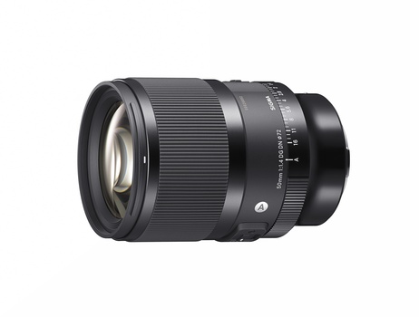 Black telephoto lens with focus ring and distance scale markings on white background.