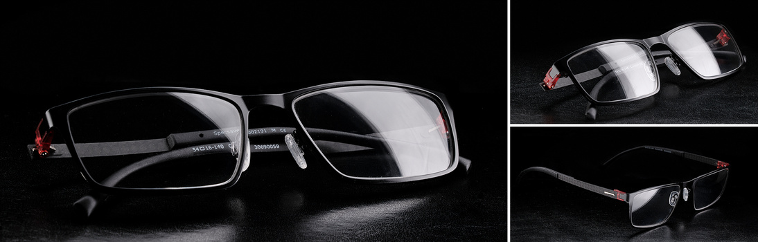 Eyeglasses with black rectangular frames and red accent details shown from multiple angles against a dark background.
