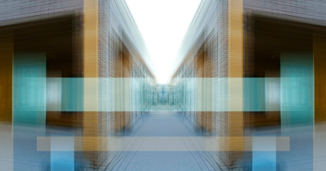 Symmetrical architectural corridor with mirrored composition creating a vanishing point effect.