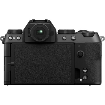 Rear view of a mirrorless digital camera with black textured body and LCD screen.