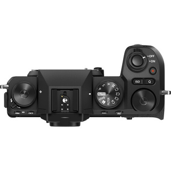 Top-down view of a mirrorless camera body with dual control dials and articulating grip.