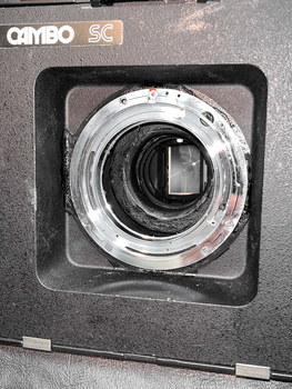 Cambo SC view camera lens assembly mounted in black bellows housing with square frame.